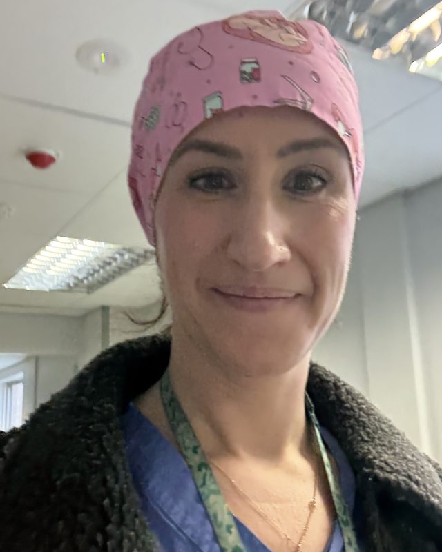 Dr Claudia Raperport in theatre scrubs