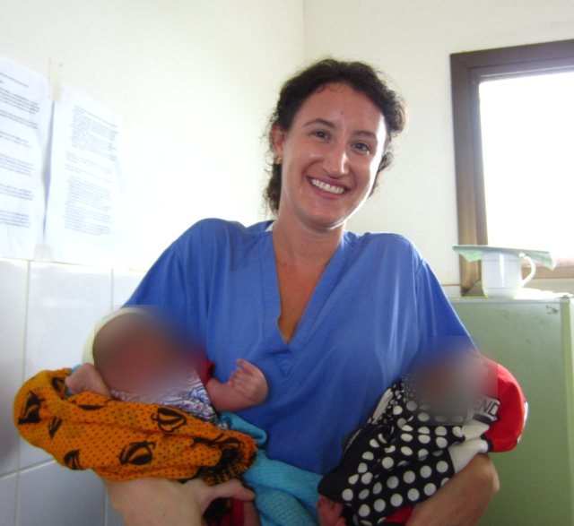 Dr Claudia Raperport holding two newborn babies at Kivunge Cottage Hospital, Zanzibar